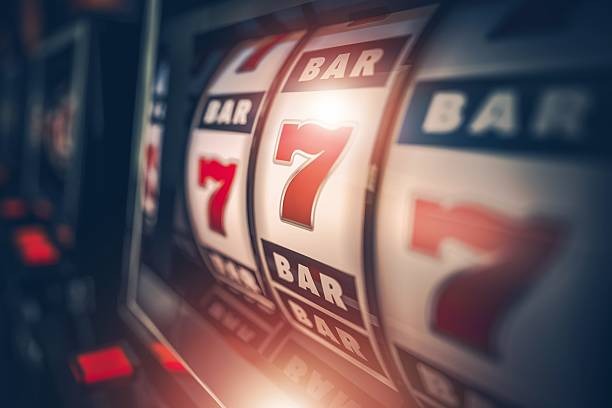 Live dealer at Nolimit City studio dealing cards at blackjack table
